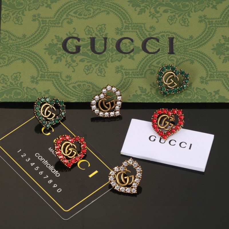 G*u*i earrings